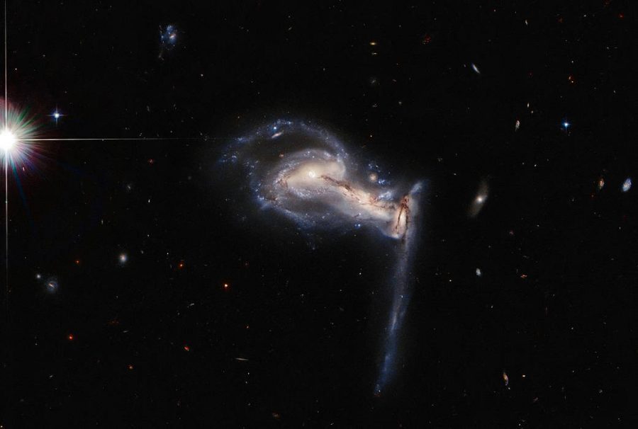 Hubble Captures Stunning Images of Galaxies Caught in a Traingular Tug of War
